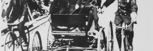 black and white photo of cyclists