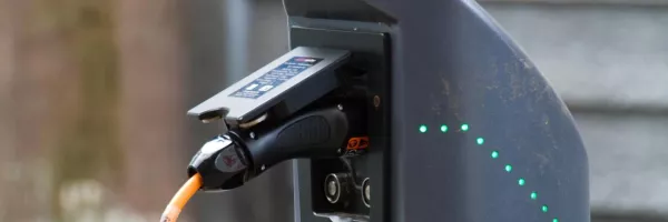 electric car plug plugged in